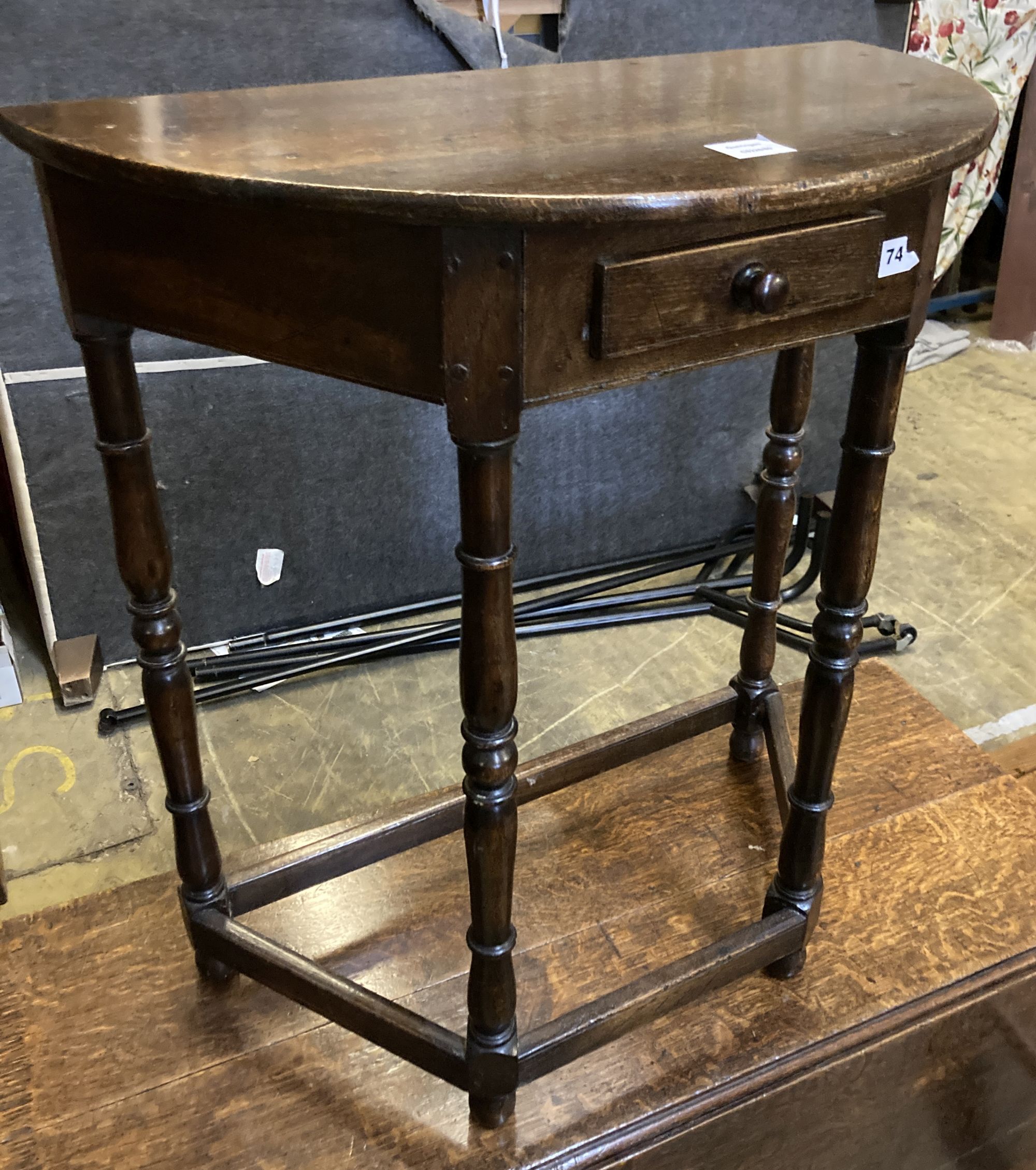 A 18th century style D shaped oak side table, width 68cm, depth 35cm, height 76cm